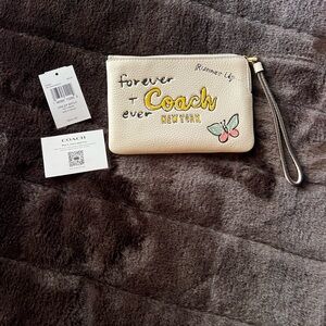 Coach Cream Wristlet with Butterfly Design